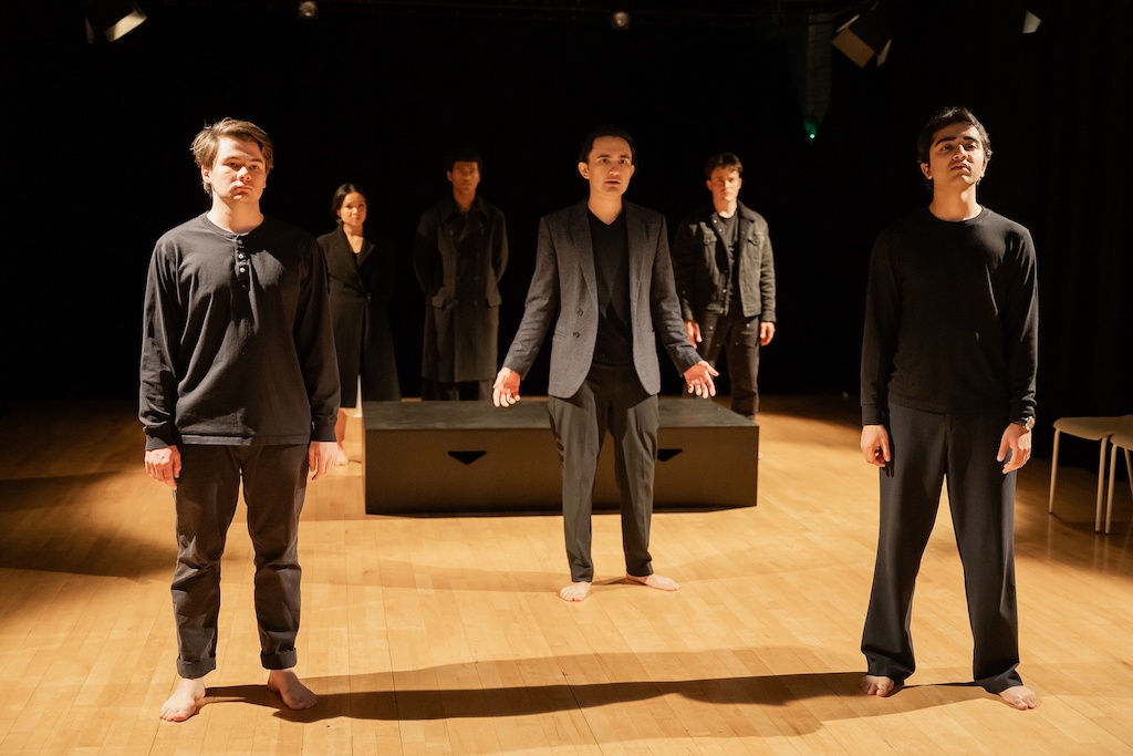 Six actors stand in various distances apart on stage during the final presentation of The Winter's Tale.